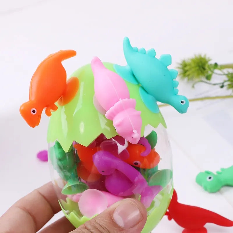 10 petits dinosaures à ventouse dans une boite œuf 